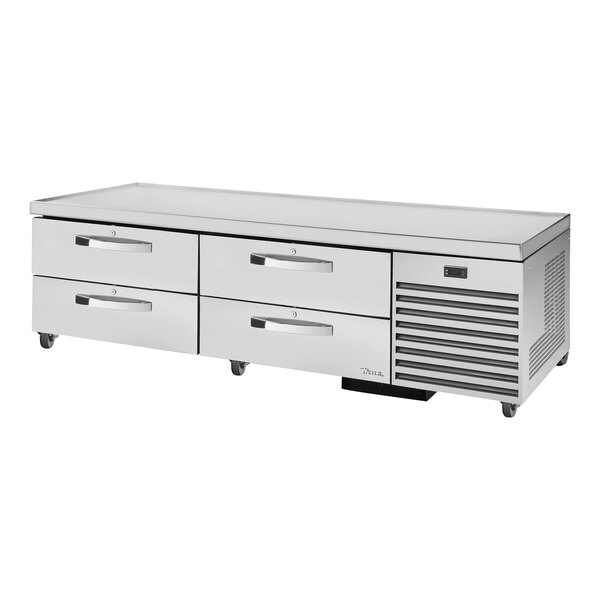 A stainless steel True refrigerated chef base with 4 drawers.