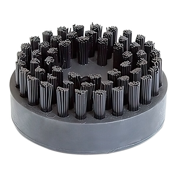A circular brush with black bristles.
