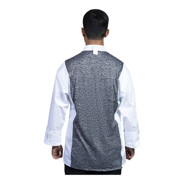 A man wearing a Uncommon Chef white long sleeve chef coat with a black and grey back mesh.