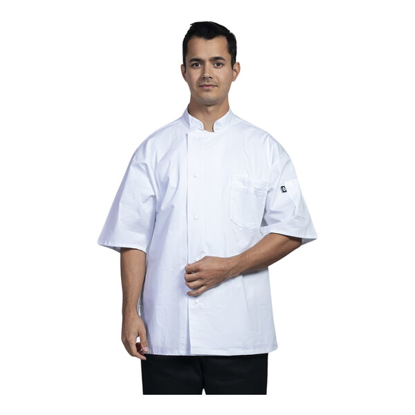 A man wearing a white Uncommon Chef Venice short sleeve chef coat with white mesh back.