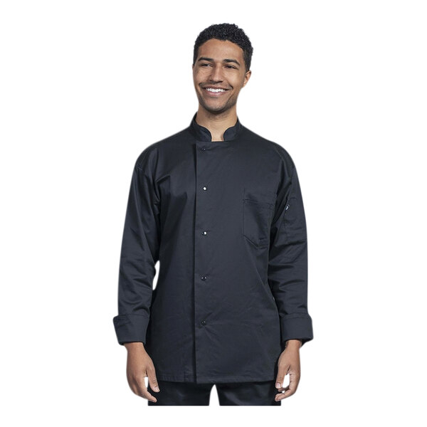 A man wearing a black Uncommon Chef long sleeve chef coat with black mesh back smiling.