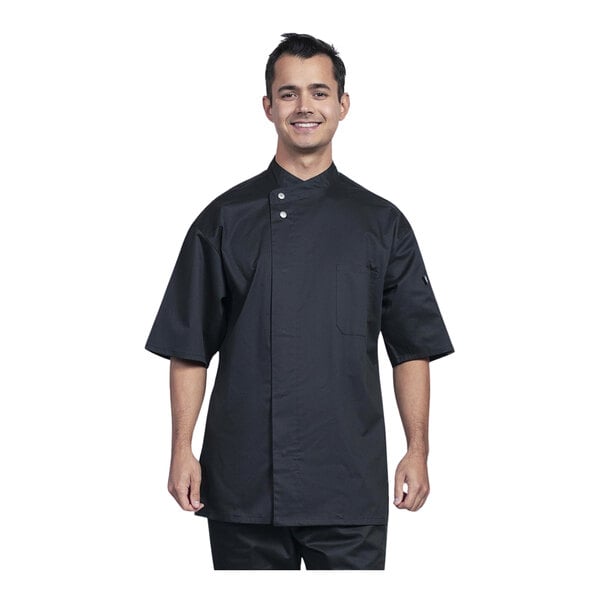 A man wearing a black Uncommon Chef Bari chef coat.