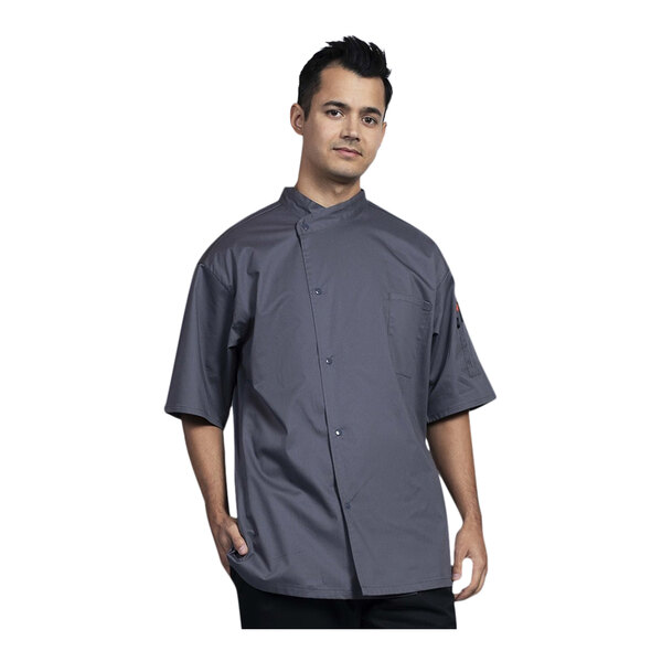 A man wearing a Uncommon Chef short sleeve chef coat with slate accents.