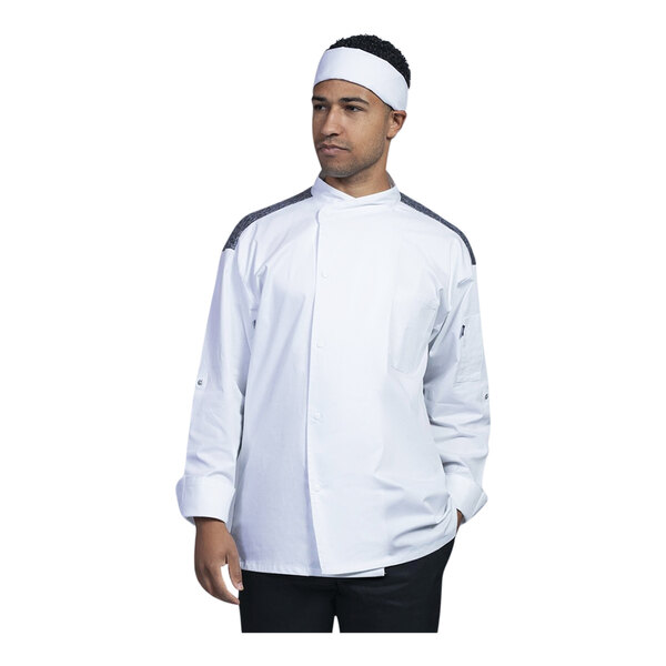 A man wearing a Uncommon Chef white long sleeve chef coat with black mesh back.