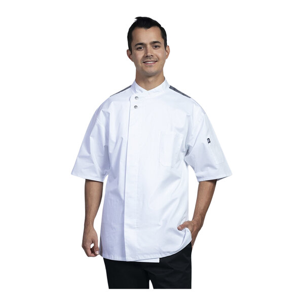 A man wearing a white Uncommon Chef Brac chef coat with black mesh.