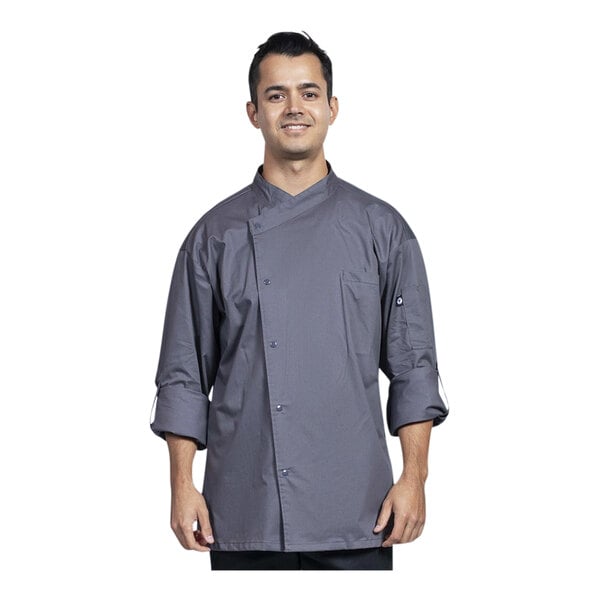 A man wearing a Uncommon Chef slate long sleeve chef coat with a slate mesh back.