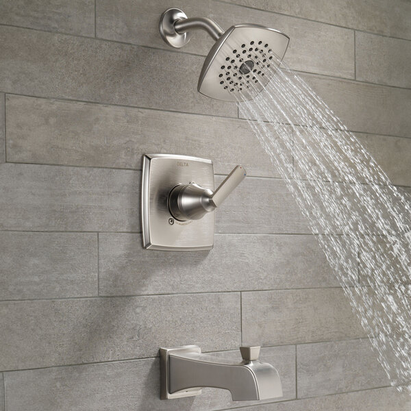 The Delta Ashlyn stainless steel bath and shower trim kit with a metal knob.