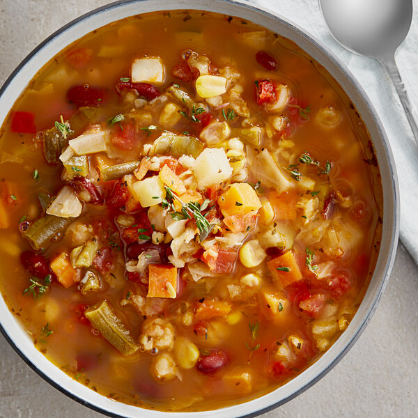 A bowl of Vienna Beef Farmer's Market vegetable soup with vegetables and spices.