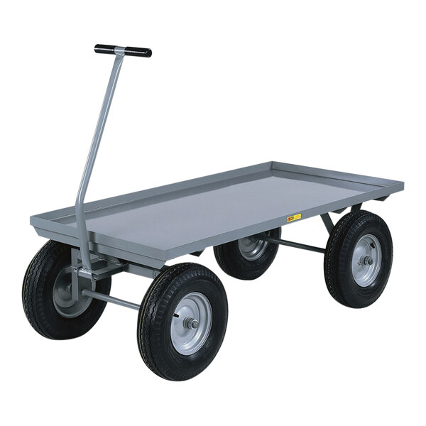 A gray metal Little Giant wagon truck with lipped edges and black pneumatic wheels.