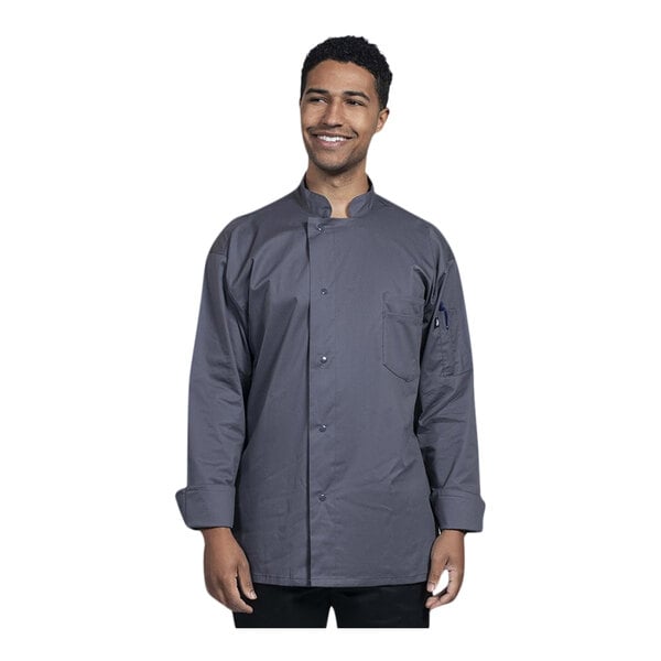 A man wearing a Uncommon Chef Turin long sleeve chef coat with a mesh back.