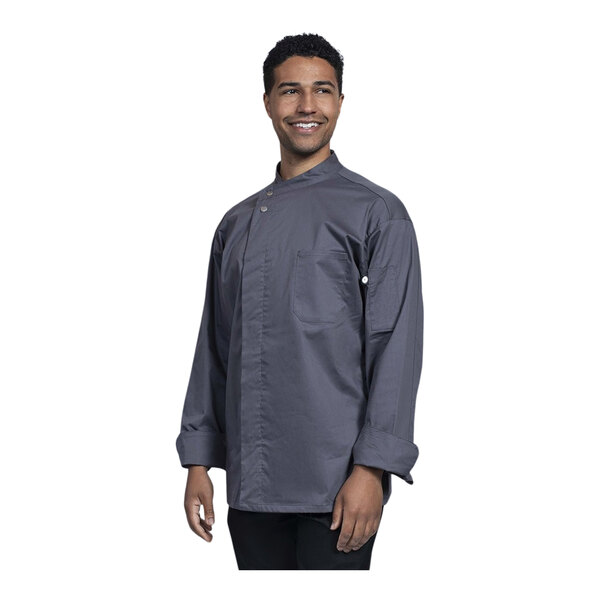 A man wearing a Uncommon Chef slate grey long sleeve chef coat with a mesh back.