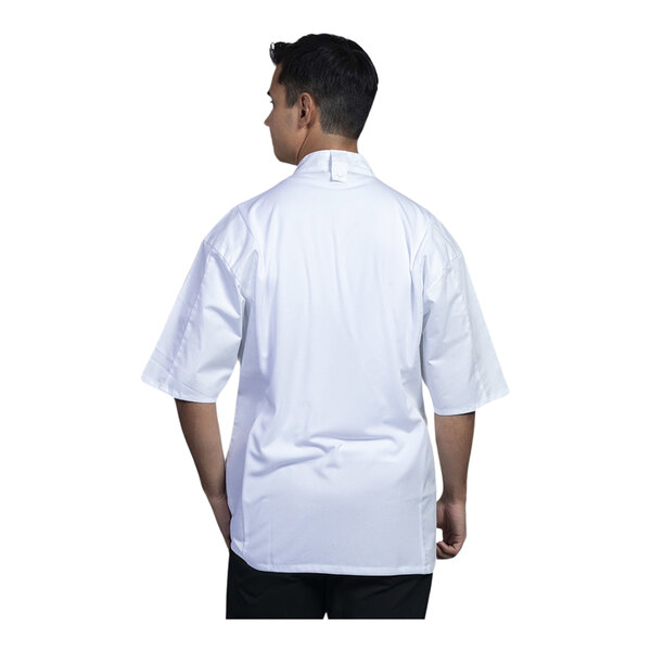 A man wearing a white Uncommon Chef Venice short sleeve chef coat with a white mesh back.