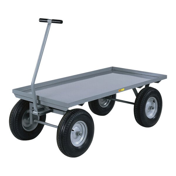 A gray metal Little Giant wagon truck with black pneumatic wheels.