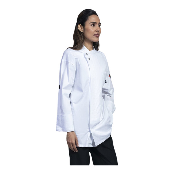 A woman wearing a white Uncommon Chef long sleeve chef coat with white mesh back.