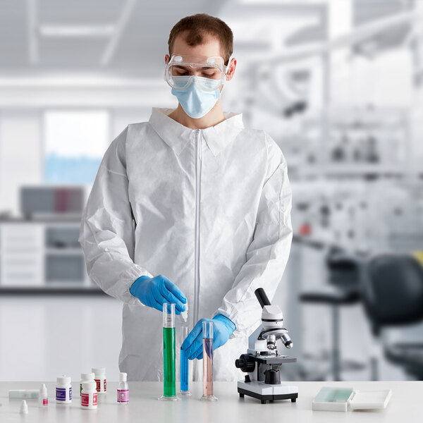 A man wearing a Lavex white microporous coverall suit.