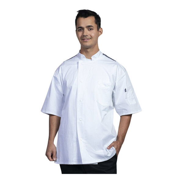 A man wearing a Uncommon Chef white short sleeve chef coat with black mesh back.