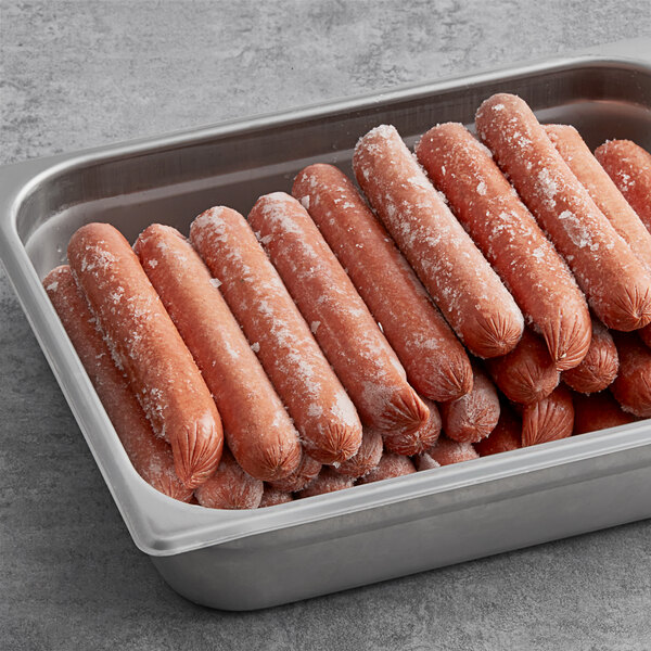 A metal tray of frozen Vienna Beef skinless beef franks with jalapenos and cheddar cheese.
