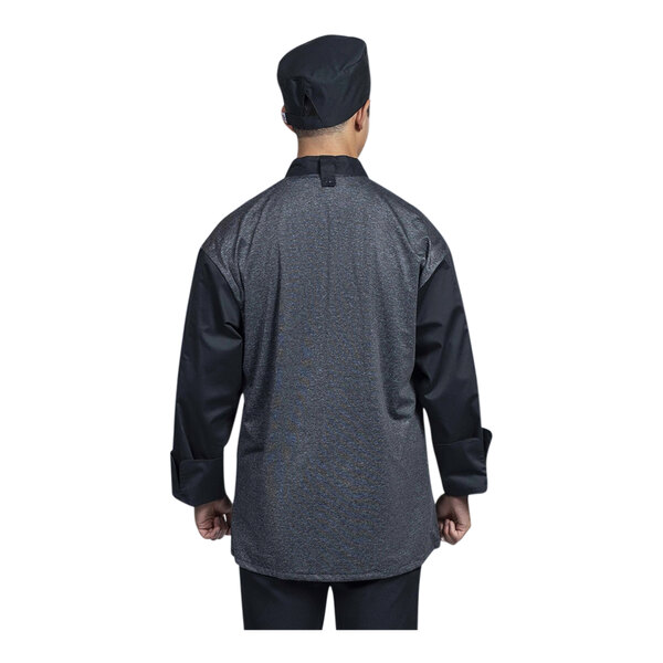 The back of a Uncommon Chef black and silver long sleeve jacket with a mesh back.