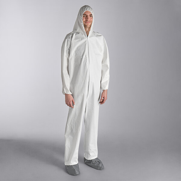 A person wearing a white Lavex coverall with attached boots and hood.