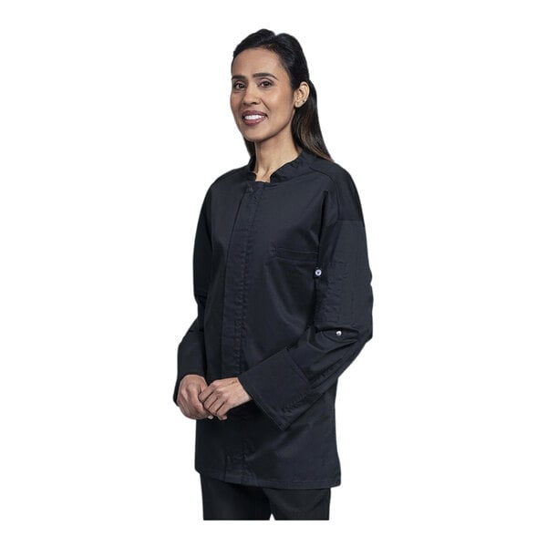 A woman wearing a Uncommon Chef black convertible long sleeve chef coat.