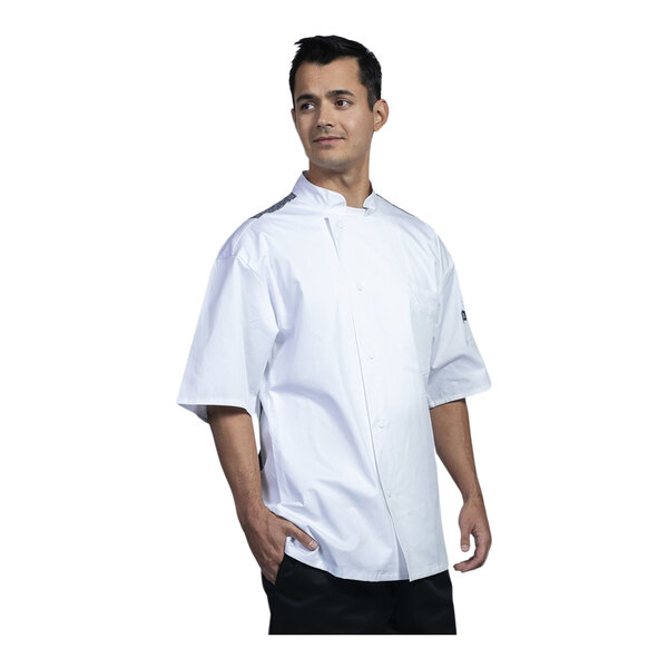 A man wearing a white Uncommon Chef Florence chef coat with a black mesh back.