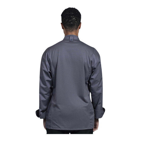 A man wearing a Uncommon Chef Turin long sleeve chef coat with a slate mesh back.