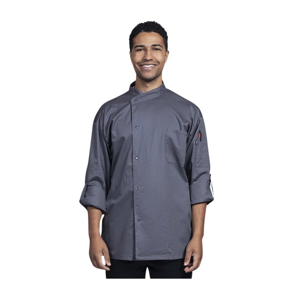 A man wearing a Uncommon Chef slate gray long sleeve chef coat with slate mesh back.