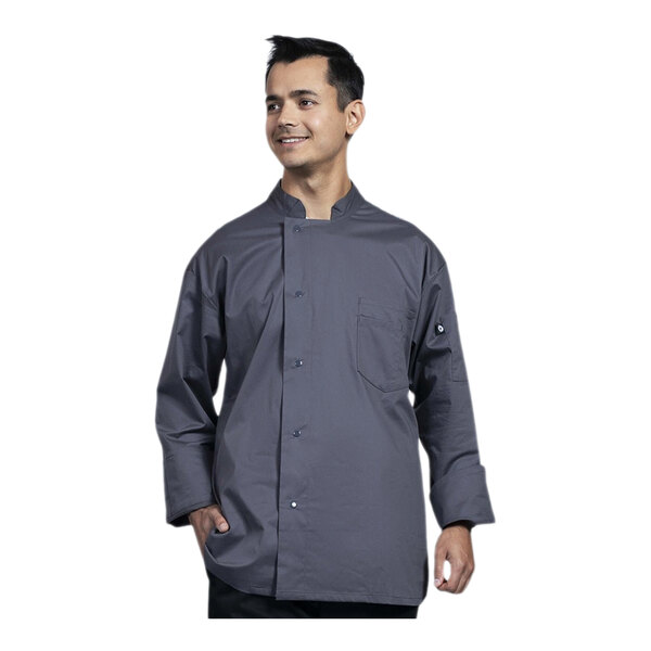 A man wearing a grey Uncommon Chef long sleeve chef coat with a grey mesh back.