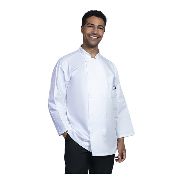 A man wearing a white Uncommon Chef Treviso chef coat with white mesh back.