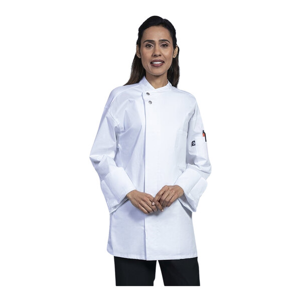 A woman wearing a white Uncommon Chef long sleeve chef coat with white sleeves and a white mesh back.