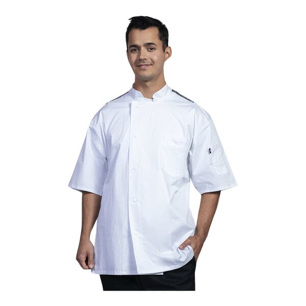 A man wearing a Uncommon Chef white and black chef coat.