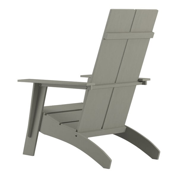 A gray wooden Adirondack chair with armrests.