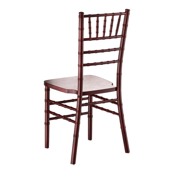 A mahogany wood Chiavari chair with a decorative spindle back and square seat.
