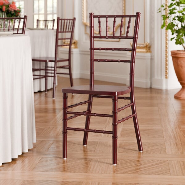 A mahogany wood Chiavari chair with a classic spindle design.