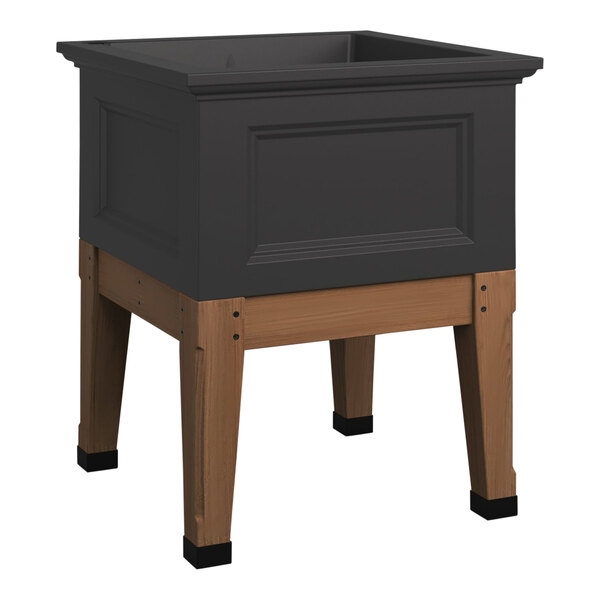 A black square box on a wooden stand.