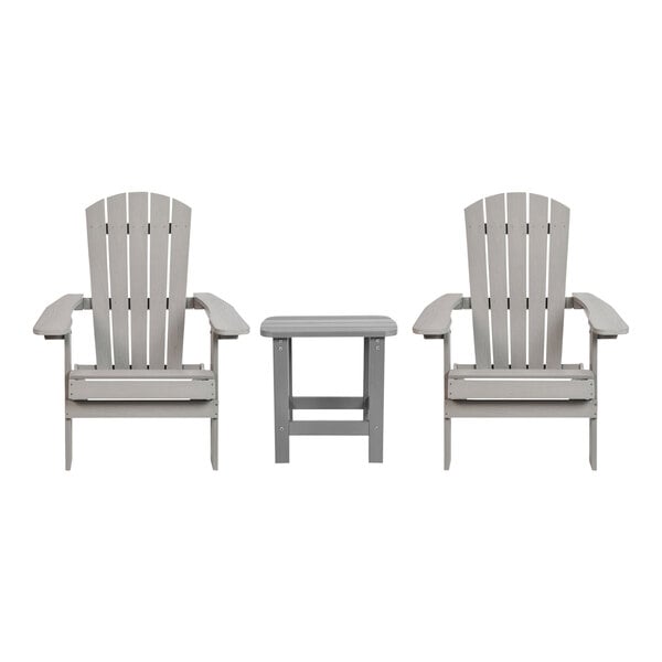 Two gray Flash Furniture faux wood Adirondack chairs with a matching table.