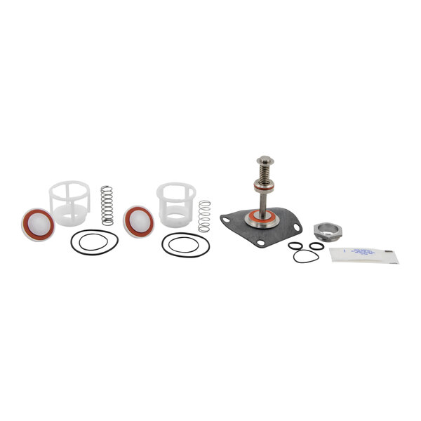 A white plastic and metal Watts repair kit for a reduced pressure zone valve.