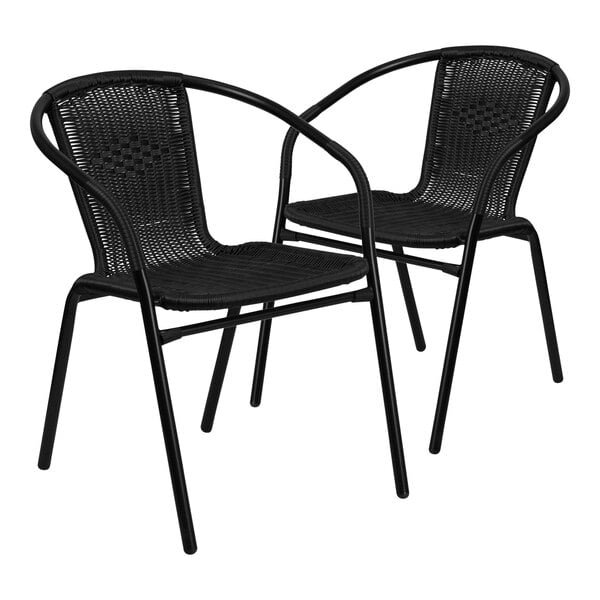 Two black Flash Furniture Lila rattan arm chairs with black wicker.