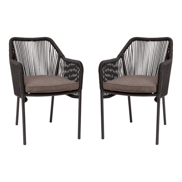 A pair of Flash Furniture black synthetic wicker arm chairs with gray cushions.