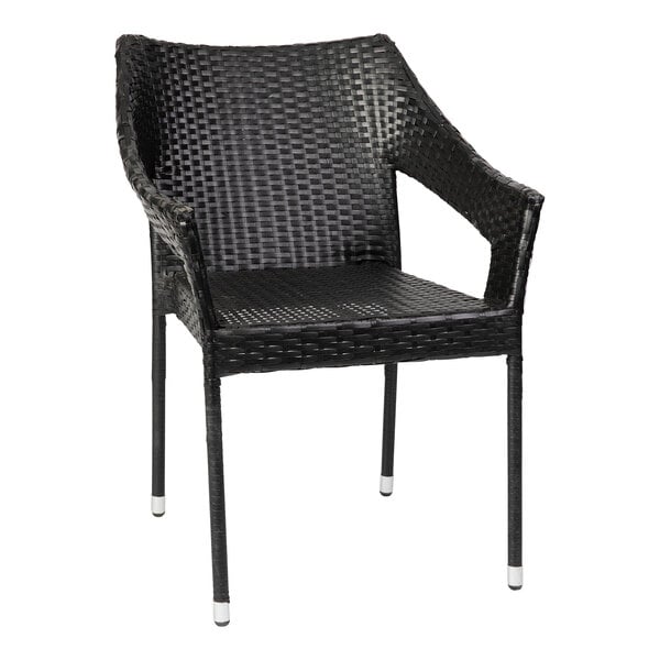 A black synthetic rattan arm chair with metal legs.