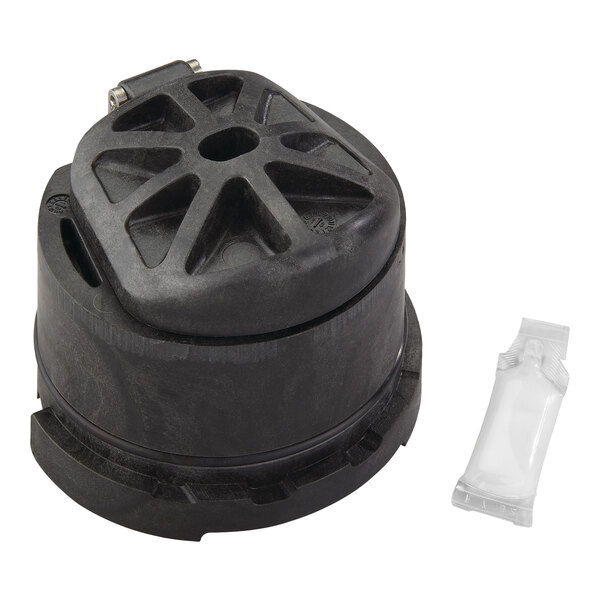 A black round Watts replacement kit with a small white bag inside.