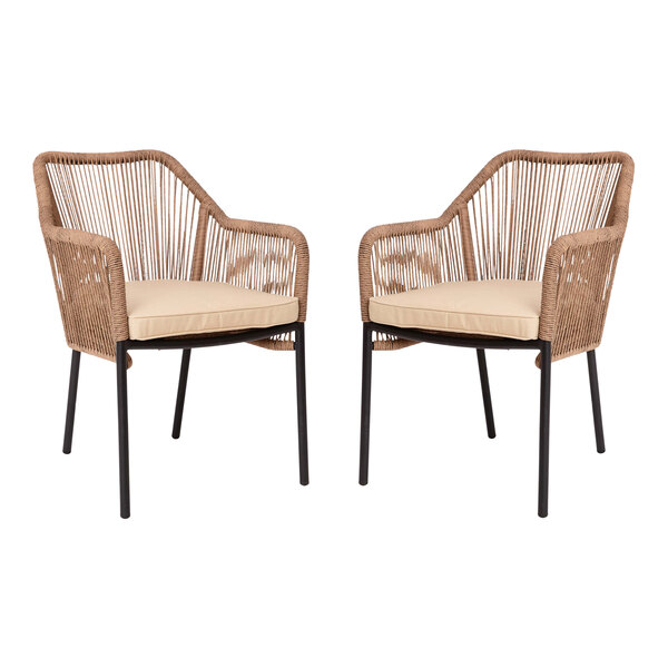 A pair of Flash Furniture wicker arm chairs with ivory cushions.