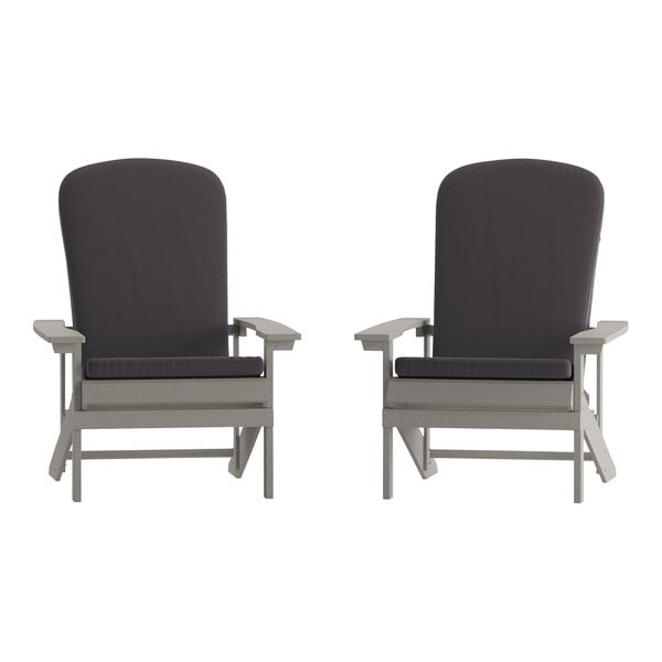 Two gray Flash Furniture Adirondack chairs with gray cushions on a white background.