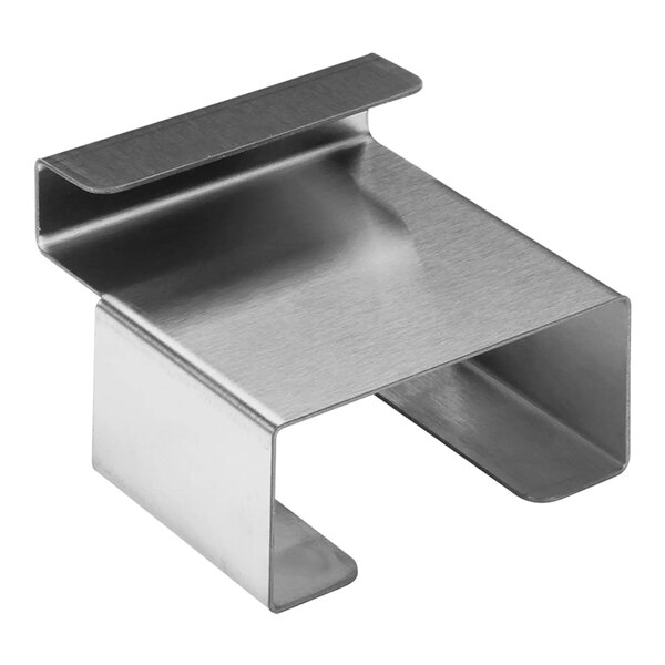 A black metal Hatco scoop holder on a metal shelf.