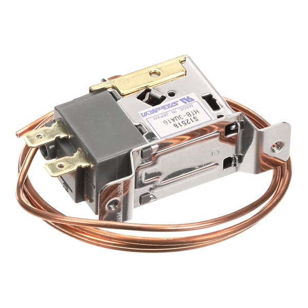 A Manitowoc Ice fan cycle switch with copper wires.