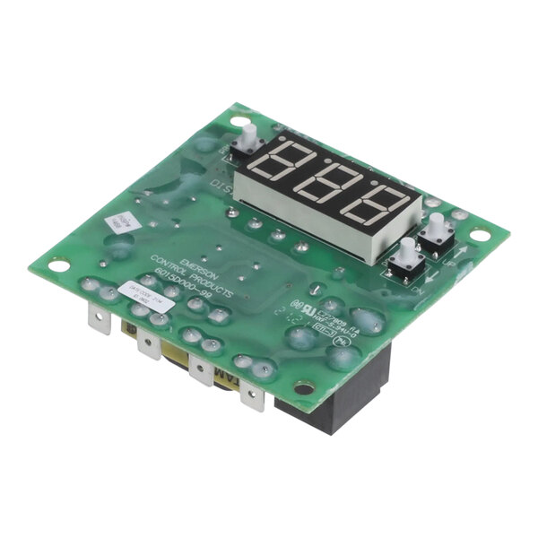 A green circuit board with a digital display.