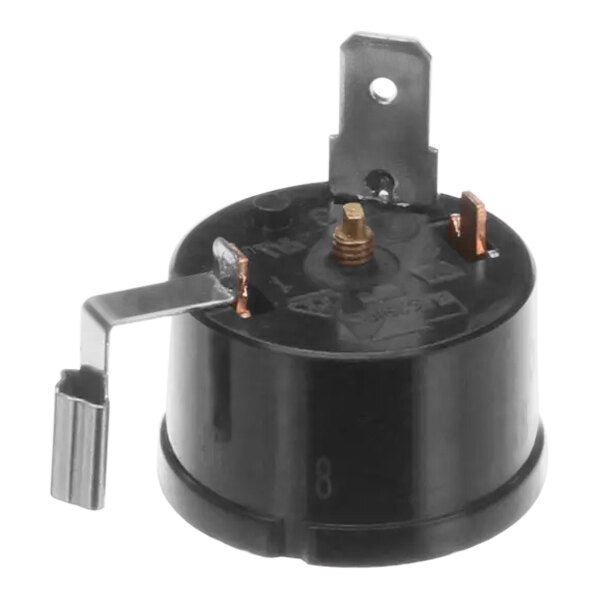 A black round compressor overload for a Manitowoc Ice machine.