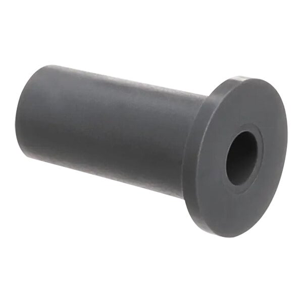 A close-up of a grey rubber cylinder with a black circle in it.