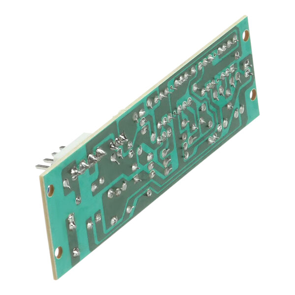 A green circuit board with silver metal components.