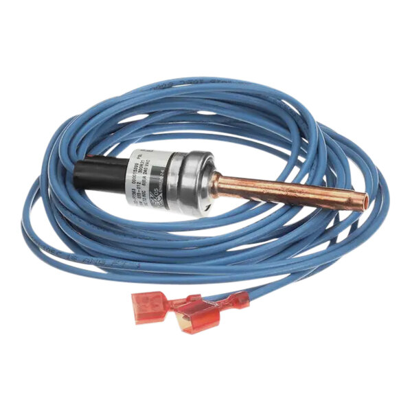 A blue cable with a red connector and metal device attached to a copper pipe.